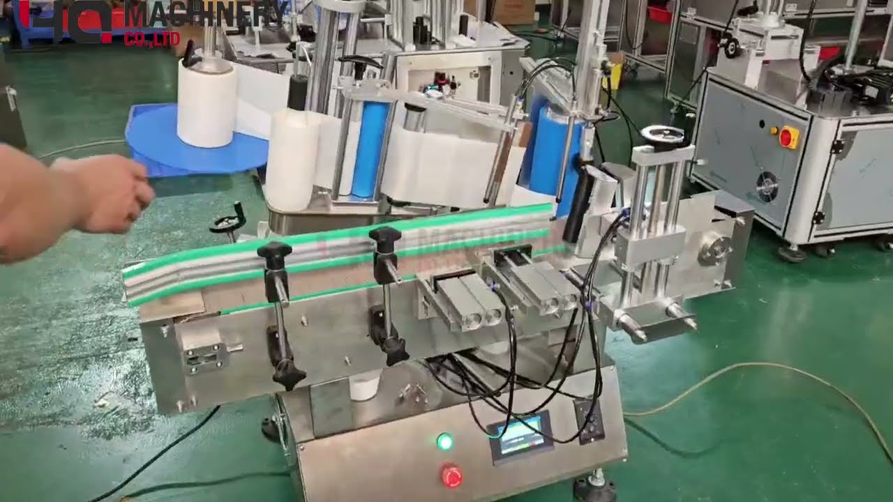 wrap around label applicator for tapered jars  