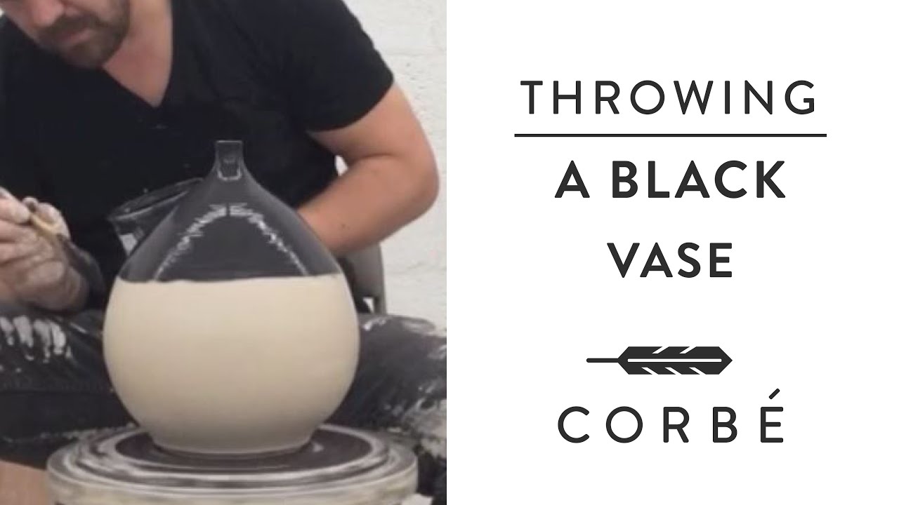 Throwing a Black Vase on the Pottery Wheel