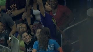 Fan tumbles to make fantastic grab on foul