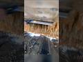 The process of cleaning biofouling from the ship's hull using a scraper #shorts