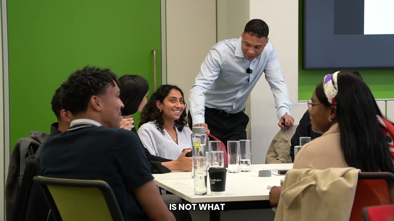 People applauding during a workplace wellbeing session.