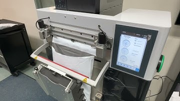 Rollbag R785 Auto Bagger - Packaging Apparel in 12x15.5 poly mailers with direct printing on the bag