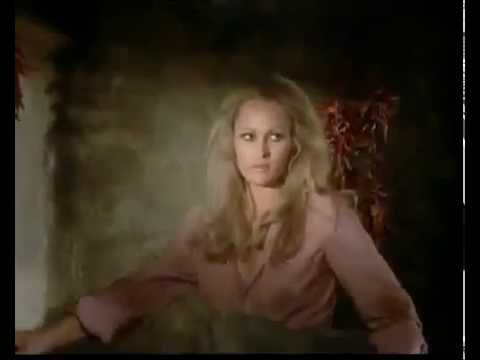 Cristina (Ursula Andress) disrobes to outfox Link Stuart