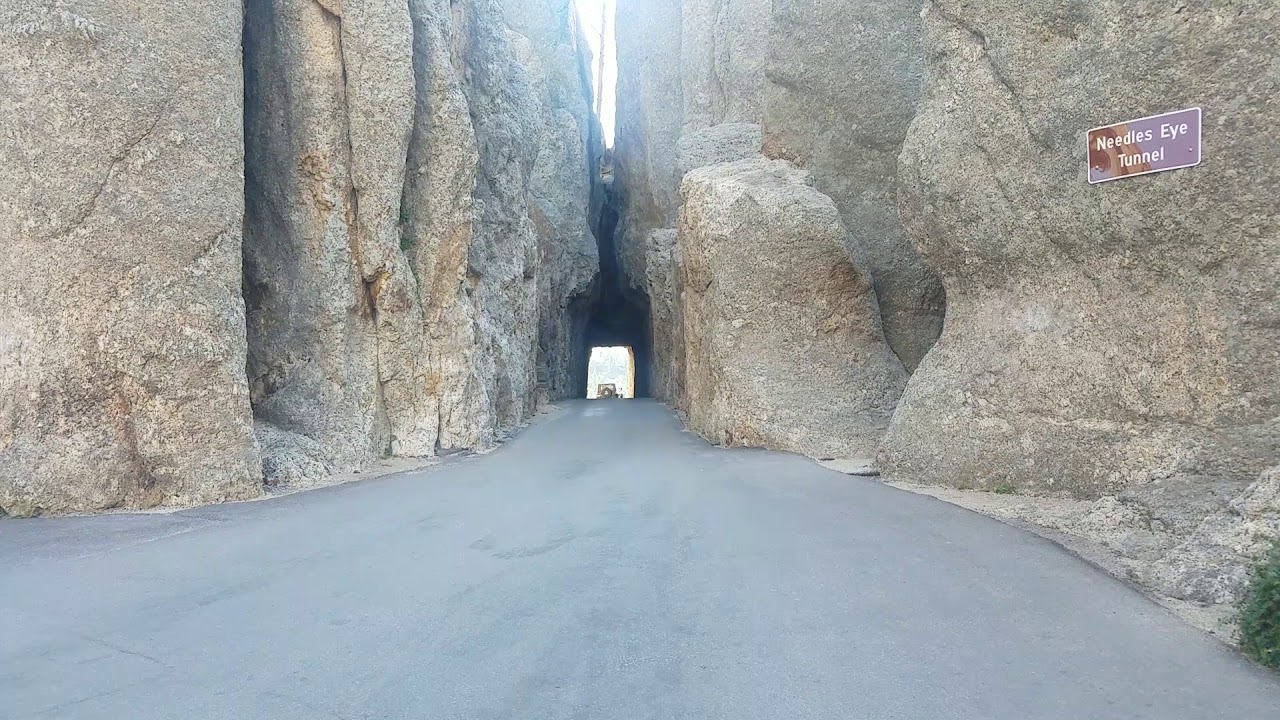 Driving Jeep Wrangler through the Needles Eye Tunnel in Custer State
