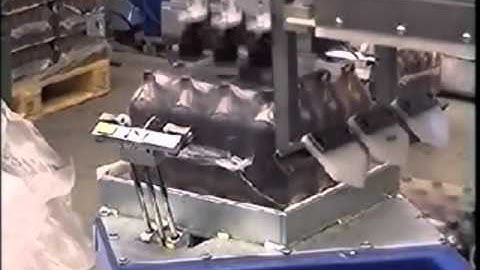 Motoman robot unwrapping bottles