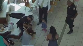 Surveillance video shows 2 officers saving choking baby