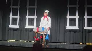 TRCS Little Mermaid play. Isaiah Juarez as Chef Louis with the Les Poissons.