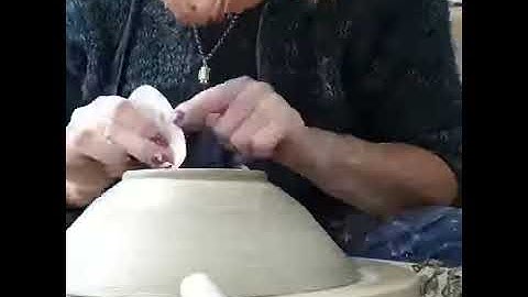 throwing a pottery bowl