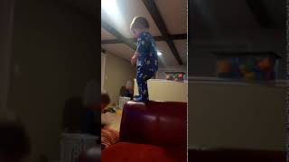 Little Kid Tries Jumping From Sofa And Ends Up Colliding With Brother - 1090009
