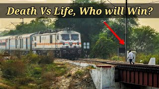 तेज रफ्तार ट्रेन के सामने भागता व्यक्ति - बाल बाल बची जान | Indian Railways