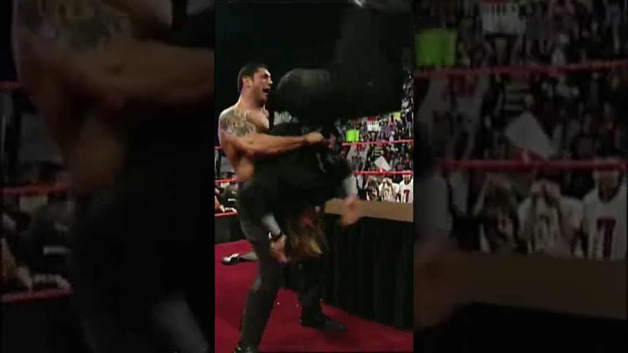 Batista powerbombs Triple H through table at contract signing #Short - WWE