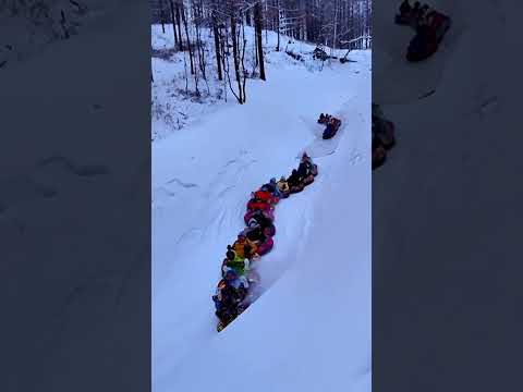 Tourists link together on snow tubes for ultimate 'snake' ride #Shorts