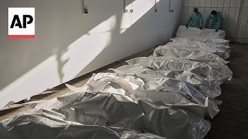 Palestinians gather at medical complex in Gaza as bodies returned by Israel are identified