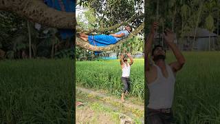 The man is sleeping on a tree branch.2901#funny