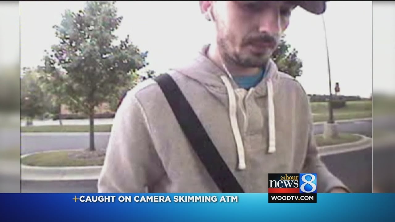 ATM skimming suspect caught on tape - YouTube