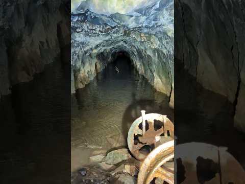 Hidden quarry into this abandoned mine has its own waterfall. let's get in and see what's inside