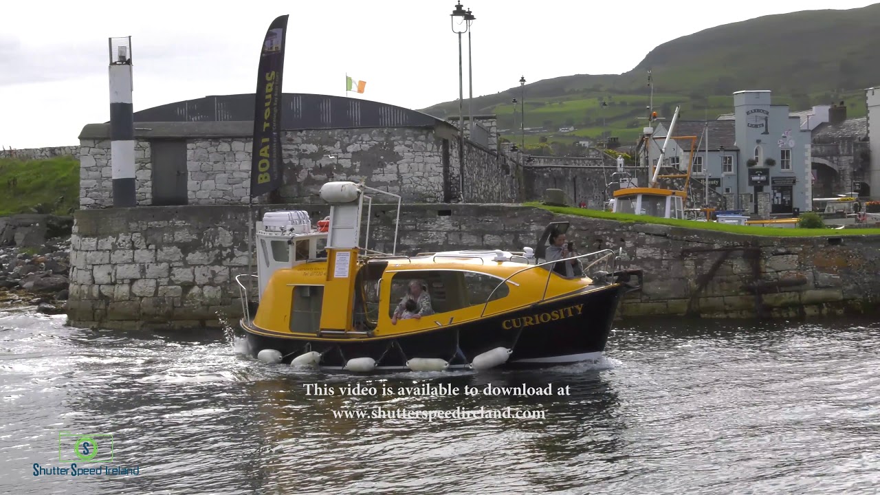 Tour boat with passengers on the Irish sea Carnlough Village Northern