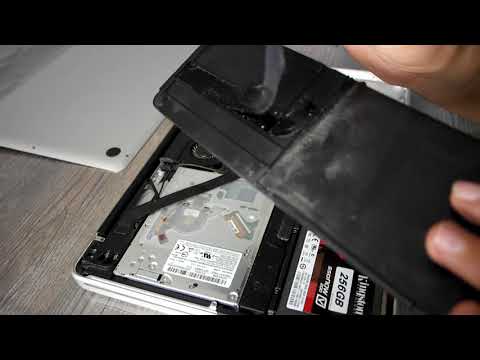 Vidéo: Comment changer la batterie de mon trackpad Apple ?