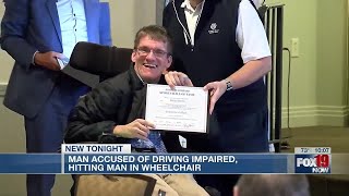 Man accused of driving impaired, hitting man in wheelchair