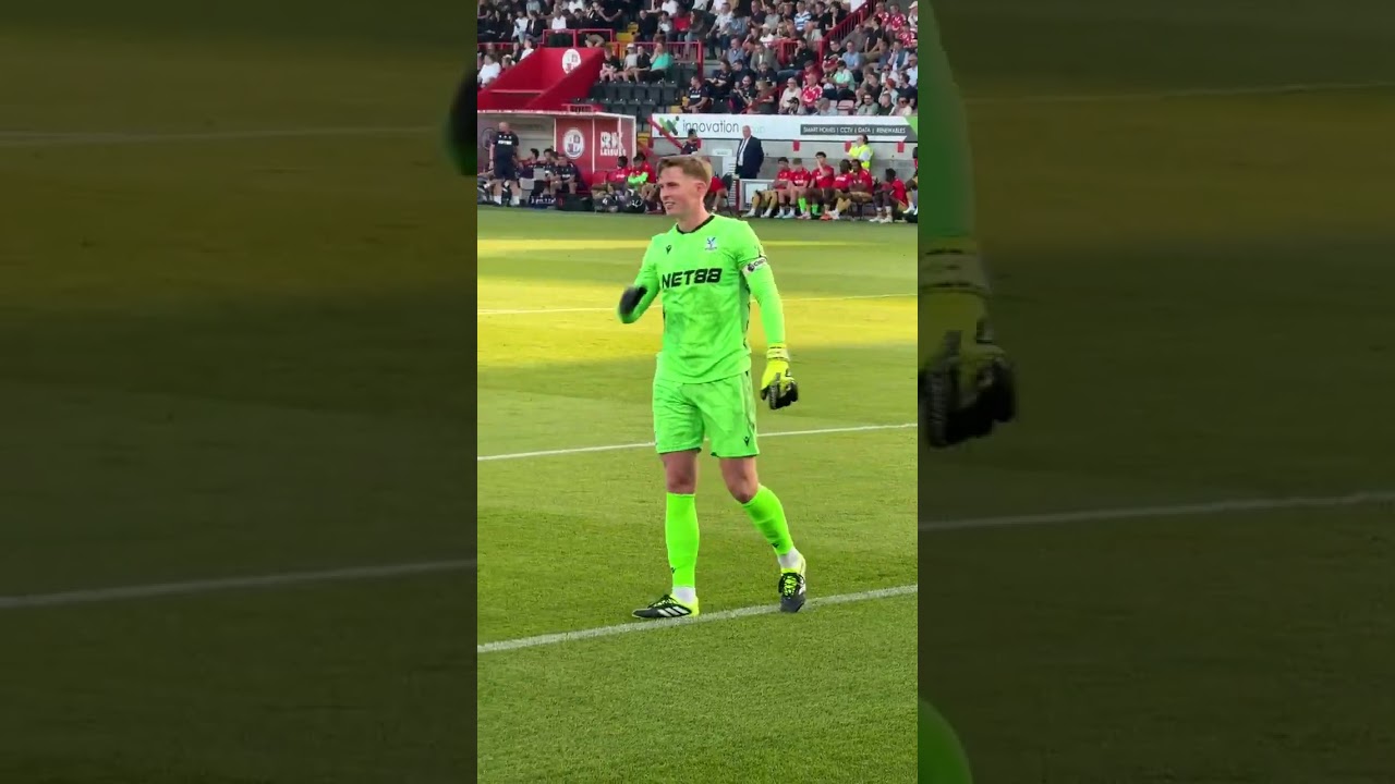 Crystal Palace goalie Dean Henderson starting the chants for the Palace fans away at Crawley