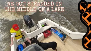 Stranded in the middle of a lake in the camping boat