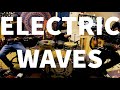 Stationary pebbles 2 guitars and a drumset electric waves