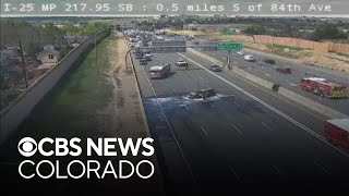 Car catches fire after crash on I-25 south, 2 injured