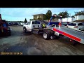 How AAA load a car on a flatbed tow truck