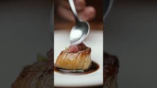 Scallop With Foie Gras, Black Currant Leaf, Vanilla Kampot Pepper.