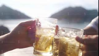 Happy group of friends toasting with a glass of beer. Cheers to success. slow motion. 3840x2160