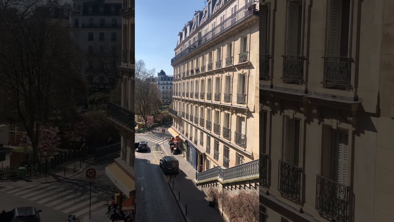 Beautiful street with stairs and old buildings in Paris