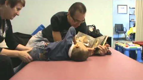 Andre reads to Soliz during his Movement Lesson ti...