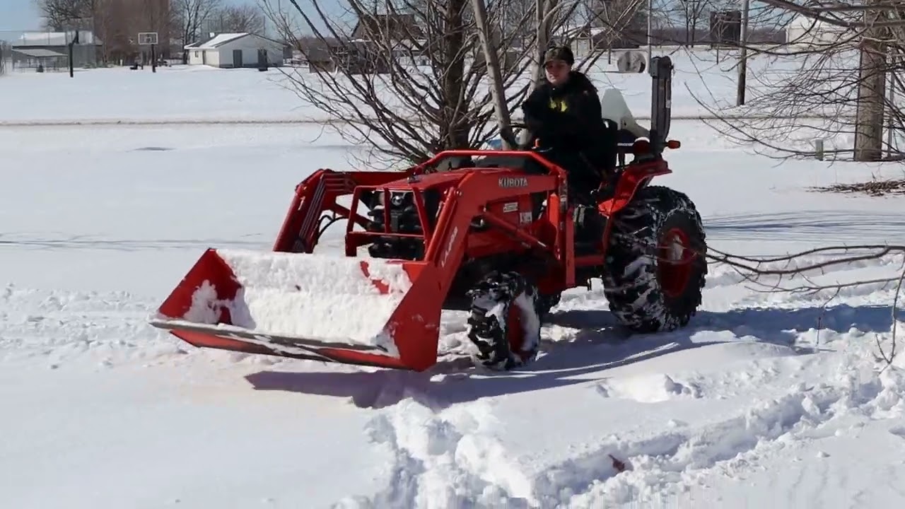 Pushing Snow With A Tractor
