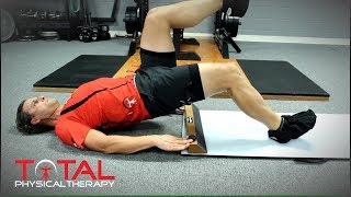 Bridge with sliding hamstring curls
