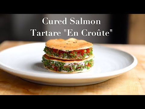 Cured salmon tartare on black pepper tuile with crème fraîche and lemon oil, from the video