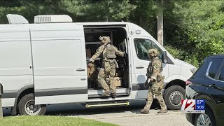 1 in custody after feds search Johnston home