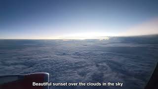 Beautiful sunset over the clouds in the sky
