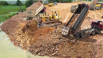 Excellent Perfectly Skill Dozer Operator Pushing SoilRock into water filling up land