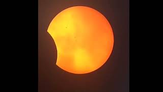 Partial Solar Eclipse with Transiting Clouds October 2023