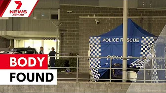 Woman found dead outside police station | 7NEWS
