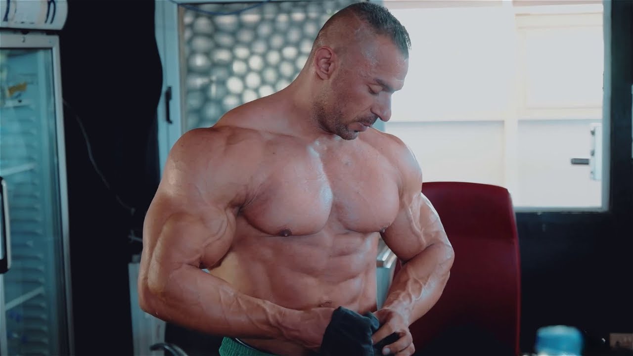 Massive bodybuilder in the gym - Biceps workout & posing