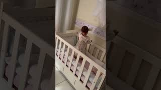 Adorable Toddler Sticks Wallpaper Sticker to Her Forehead