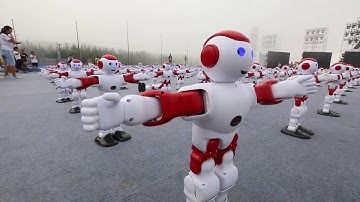 1,007 robots dancing in unison is pretty eerie.
