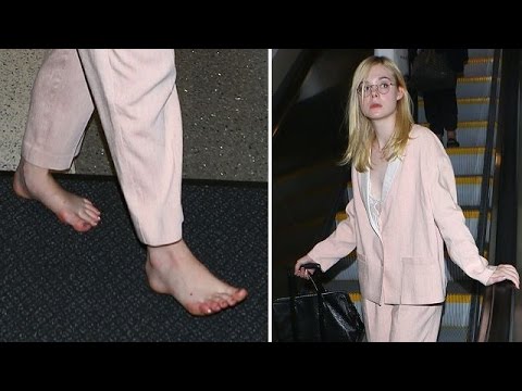 Elle Fanning Shows Off Her Funky Feet While Barefoot At LAX 