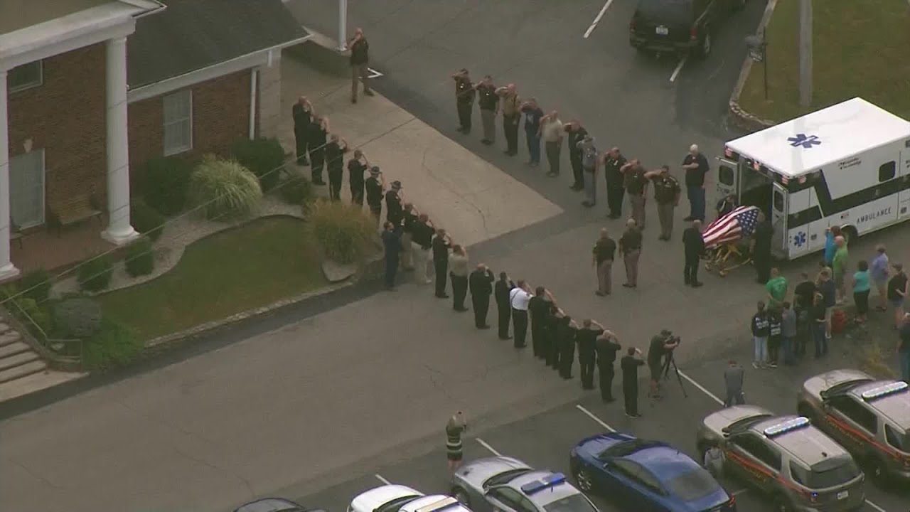 Aerials of procession for Meade County sheriff's deputy who died over