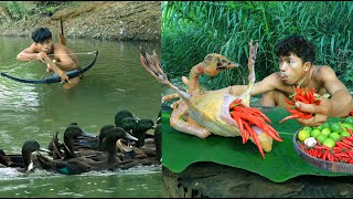 shoot duck in the water using a crossbows , Cook delicious duck