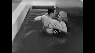 George Raft dances in the swimming pool with Gertrude Messinger in Madame Racketeer (1932)