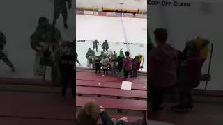 Little boy runs down bleachers at hockey game and falls forward
