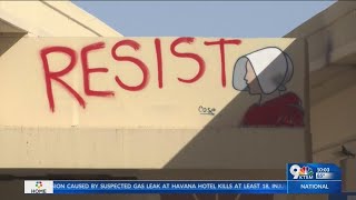 “RESIST” with graffitied Handmaid’s Tale icon found on I-10 overpass