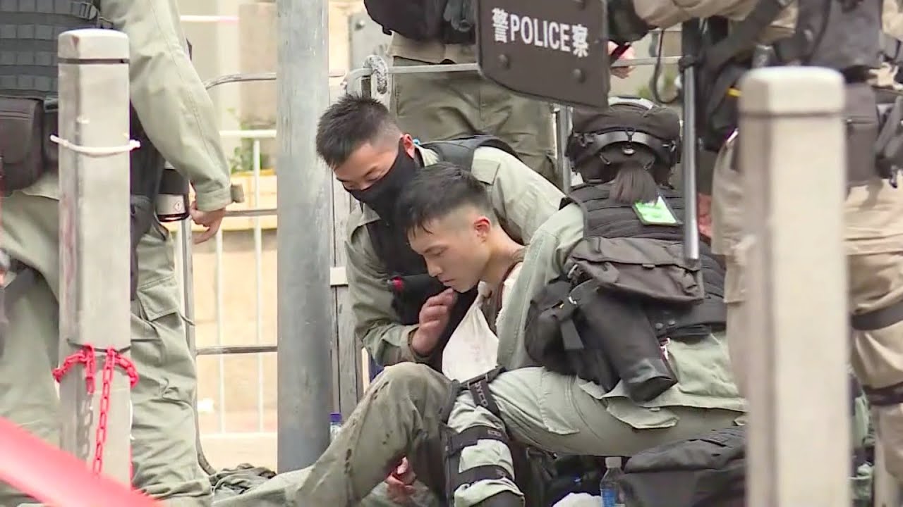 Man arrested in Hong Kong over officer stabbing during protest - YouTube